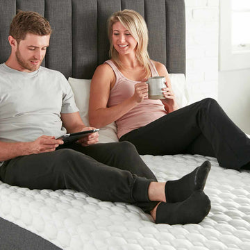 young couple relaxing on mattress